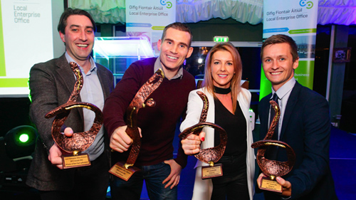 Photo of a group of people receiving awards